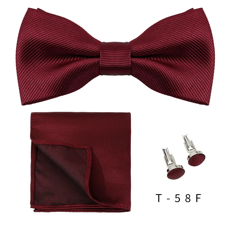 A maroon textured bow tie and a matching cufflink set displayed on a white background.