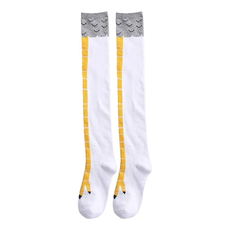 White socks with gray and yellow chicken print designs on the cuff and toe