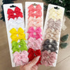 Colección de clips para el pelo en forma de lazo de colores sólidos infantiles en varios tonos como rojo, rosa, amarillo, ver