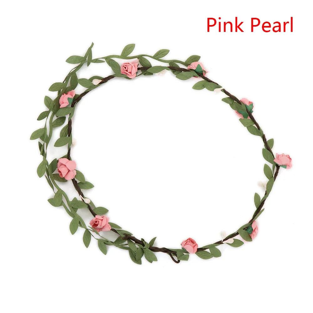 A delicate pink pearl floral wreath headband made of green leaves and roses for women
