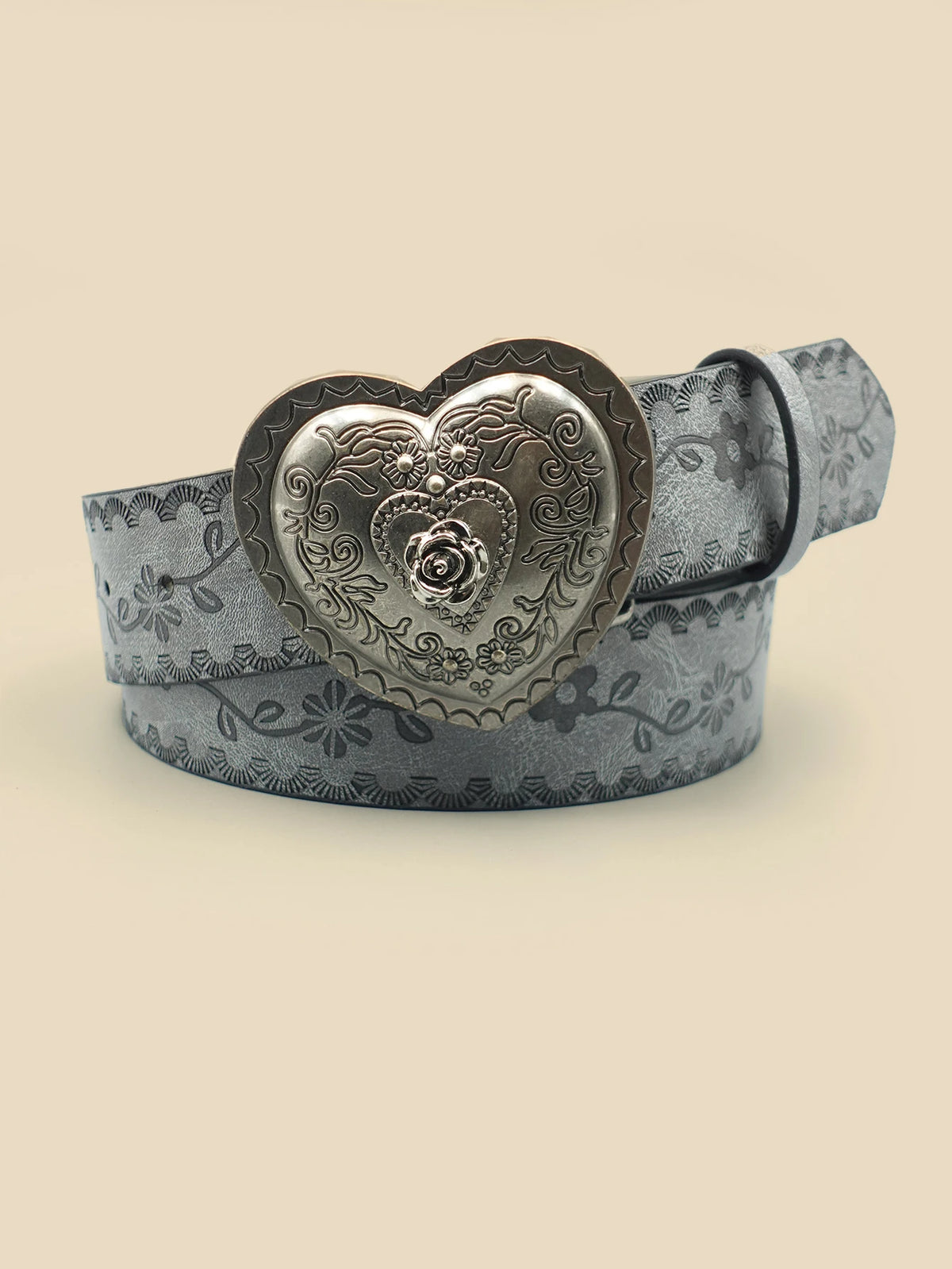 A silver heart-shaped retro embossed leather belt with floral detailing.