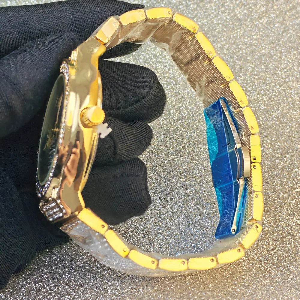 A gold and yellow quartz wrist watch with blue accents is held by a hand wearing a black glove.