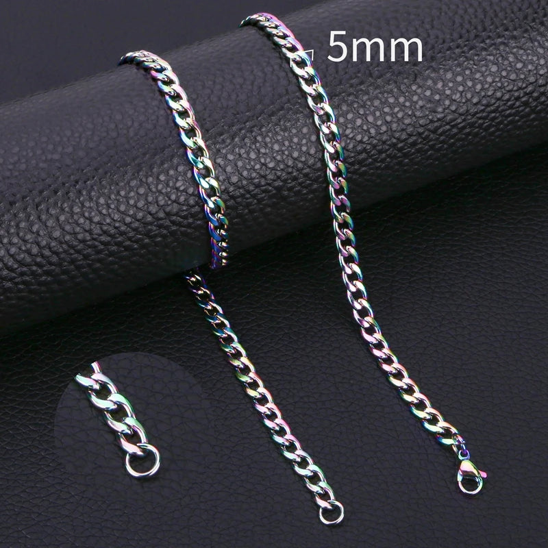 A close-up photo of a silver-toned Cuban link necklace with a 5mm chain, displayed on a black surface.