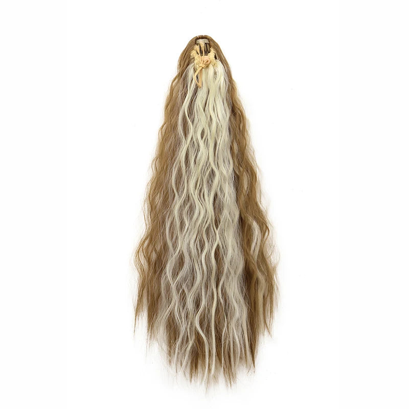 A long, blonde hair extension with kinky curly texture is shown in a ponytail.