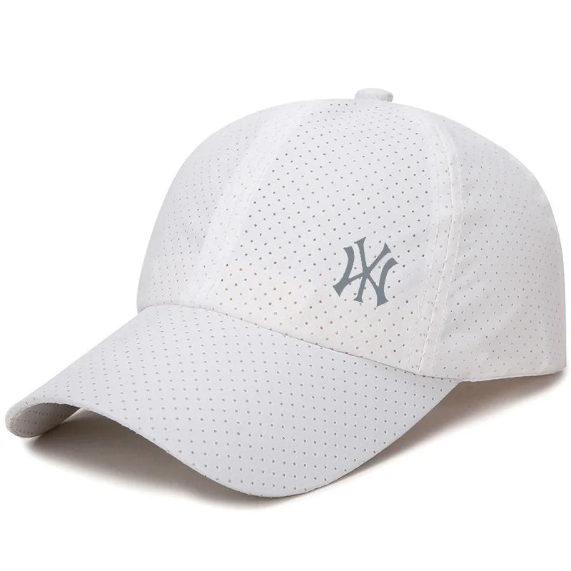 A white unisex adjustable baseball cap with a perforated texture and a small embroidered logo on the front.
