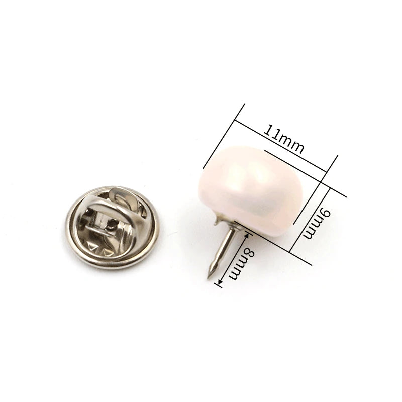 A small, round pearl button with a pin, measuring 11mm in length.