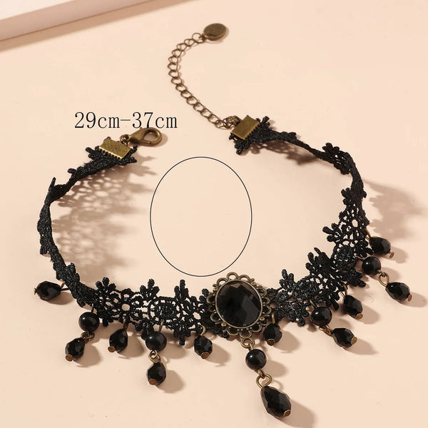 A black lace choker necklace featuring dark beads and gold accents.
