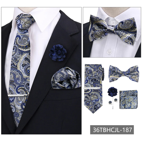 A set of men's formal tie and accessory featuring a blue and gold paisley pattern on a black suit jacket.