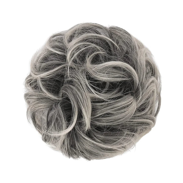 A close-up view of messy bun hair pieces scrunchies in a dusty gray color.