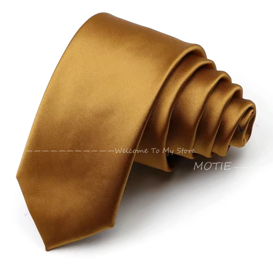 A folded golden brown satin neck tie for formal wear.