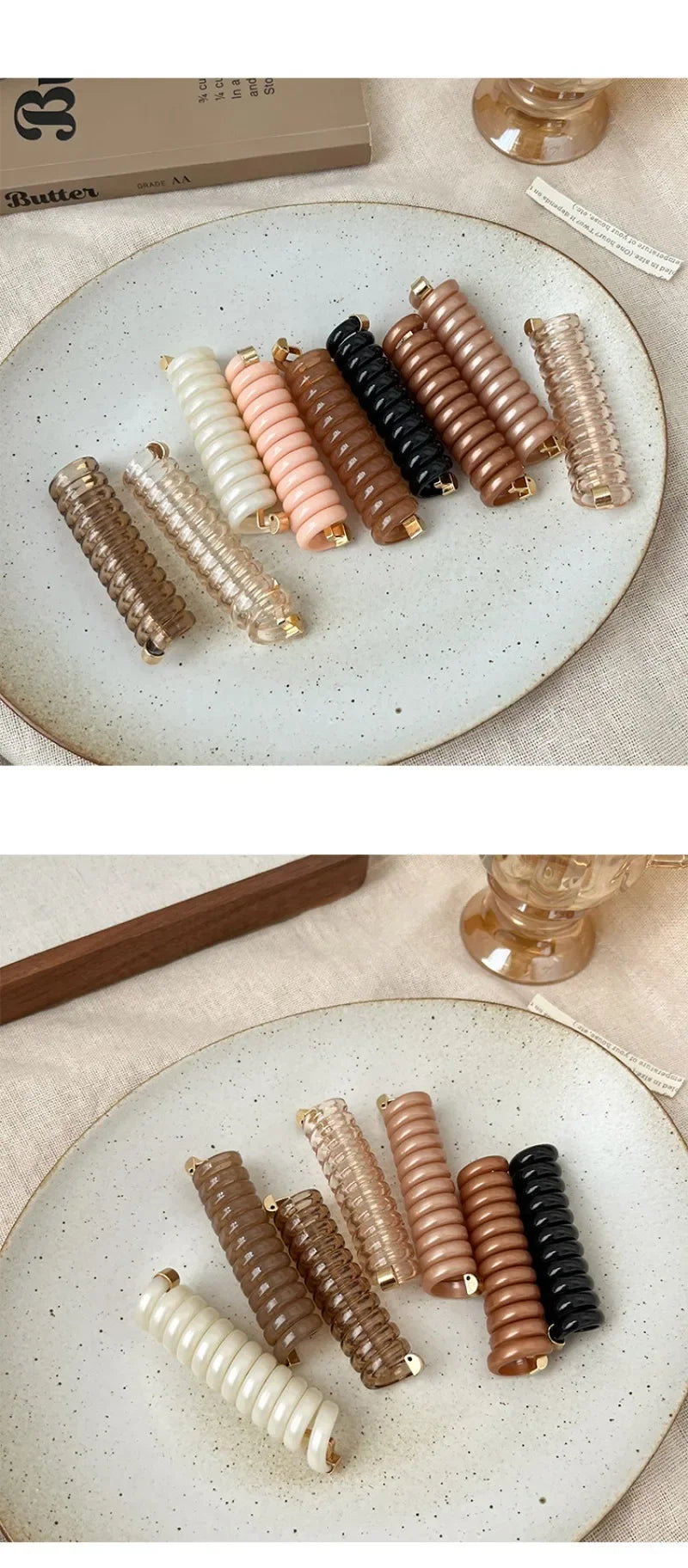 A collection of natural wood and beige rubber braided ponytail holders and scrunchies arranged on a light ceramic plate.
