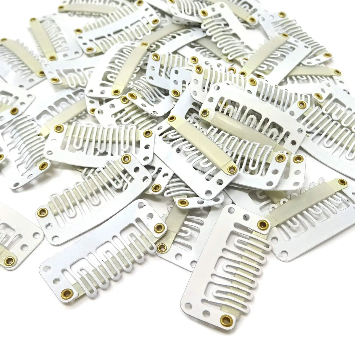 A pile of precision snap hair extensions for bangs in white and gold.