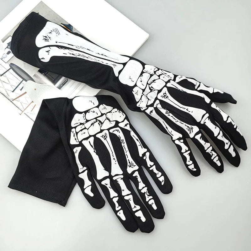 A pair of black gloves with white skeleton hand designs displayed on a white background.