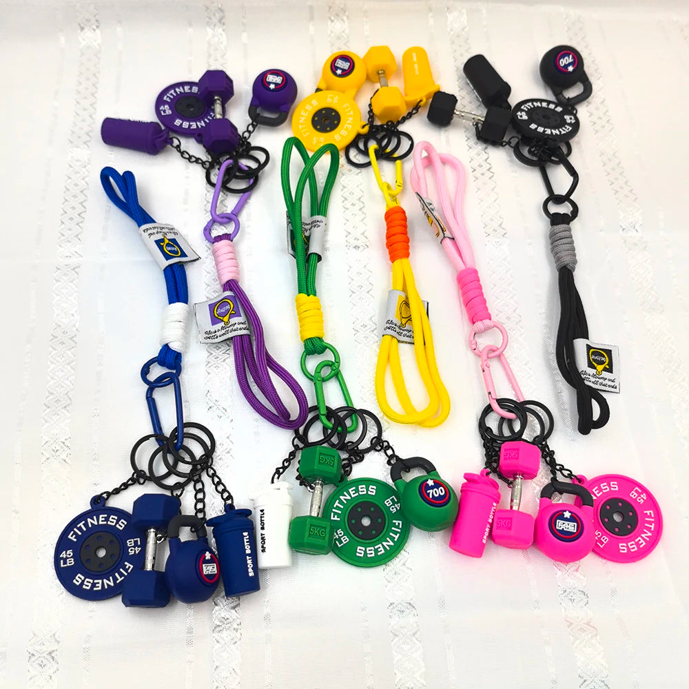 A collection of 5-in-1 fitness keychains and weightlifting accessories in various colors like purple, yellow, green, and blac