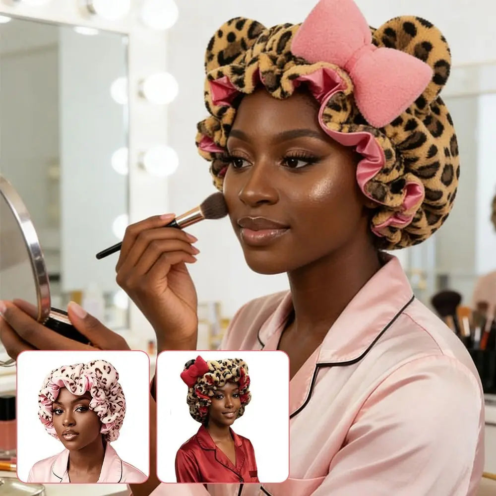 A woman models a leopard print hair drying cap with pink ruffled details.