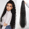 A woman models long, black synthetic drawstring hair extensions with a turtleneck top.