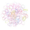 A pile of colorful elastic hair ties in various shades of pink, purple, and green.