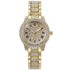 A gold-toned quartz wristwatch adorned with clear rhinestones on the bezel and bracelet.