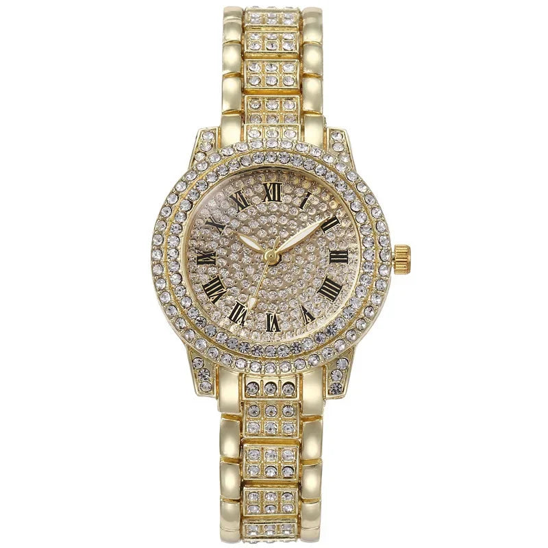 A gold-toned quartz fashion watch adorned with clear rhinestones on the bezel and bracelet.