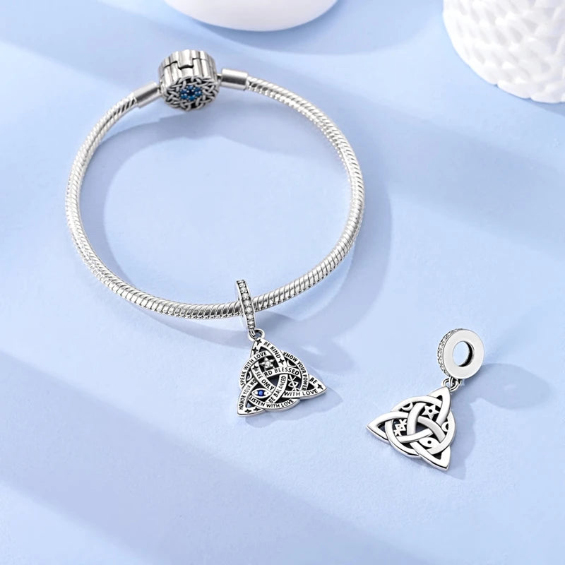 Sterling silver devil's eye charm bracelet with a triangular knot pendant