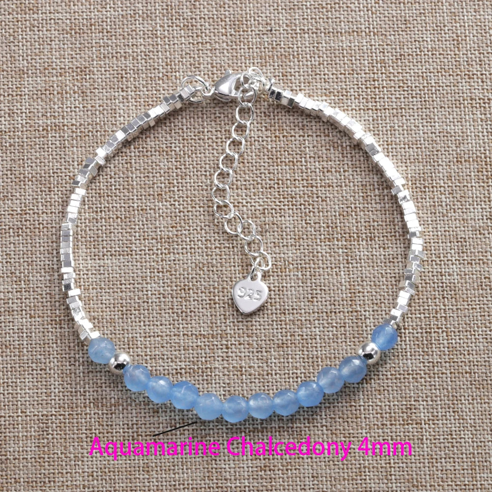 Sterling silver double heart charm bracelet with blue aquamarine beads