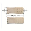 A beige adjustable bra extender strap with measurement markings showing its length and width.