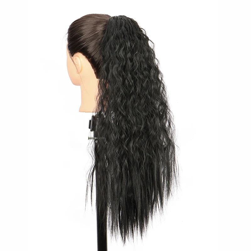 Black 22-inch synthetic kinky curly ponytail hair extension clip-in displayed on a mannequin head.