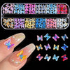 A collection of pink and white butterfly bow nail charms displayed on a fingernail.