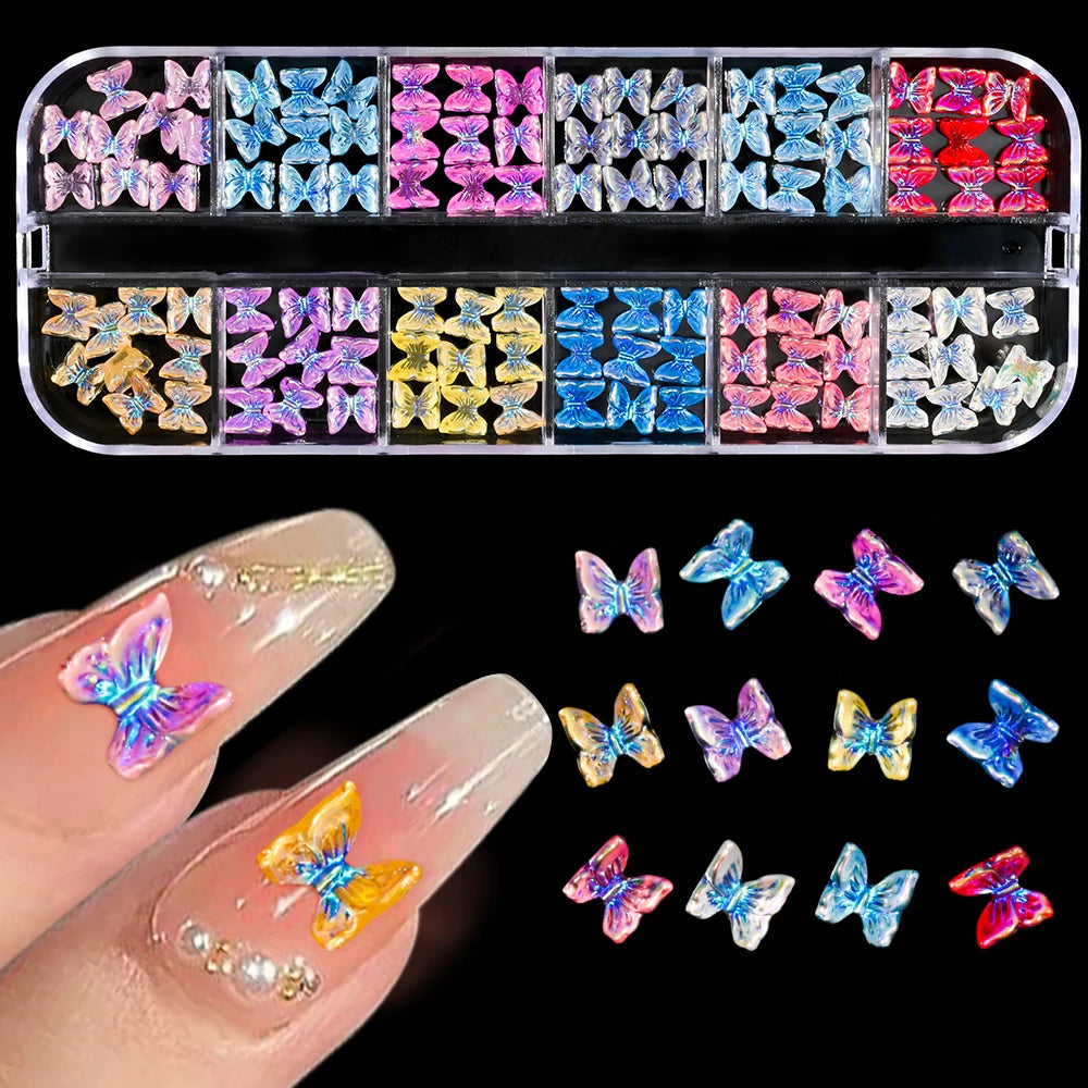 A collection of pink and white butterfly bow nail charms displayed on a fingernail.