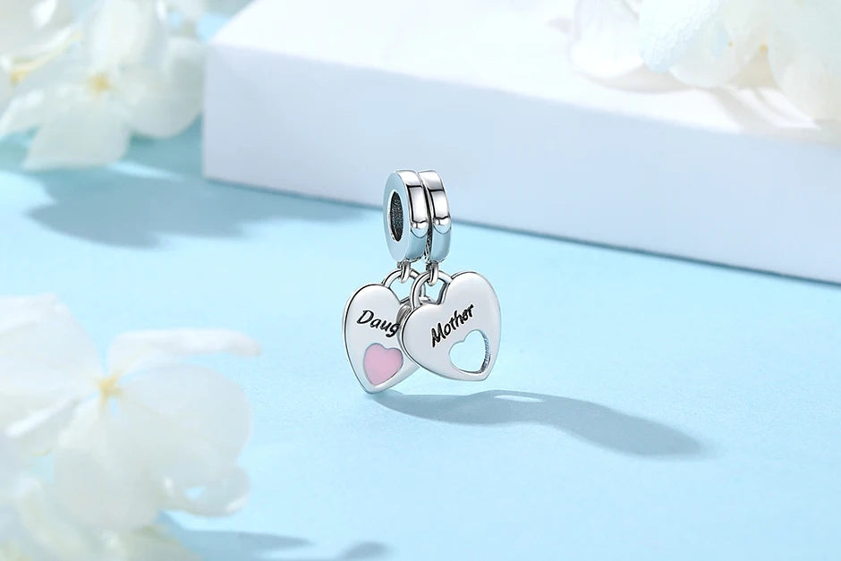 Silver heart charm necklace featuring a family tree design with the names Doug and Mother