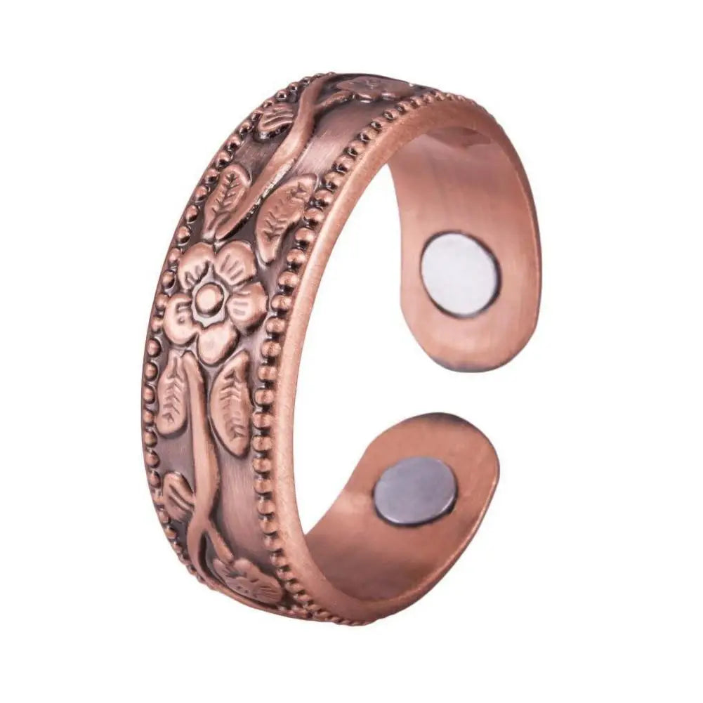 A vintage flower engraved copper bracelet and ring set with a rose design.