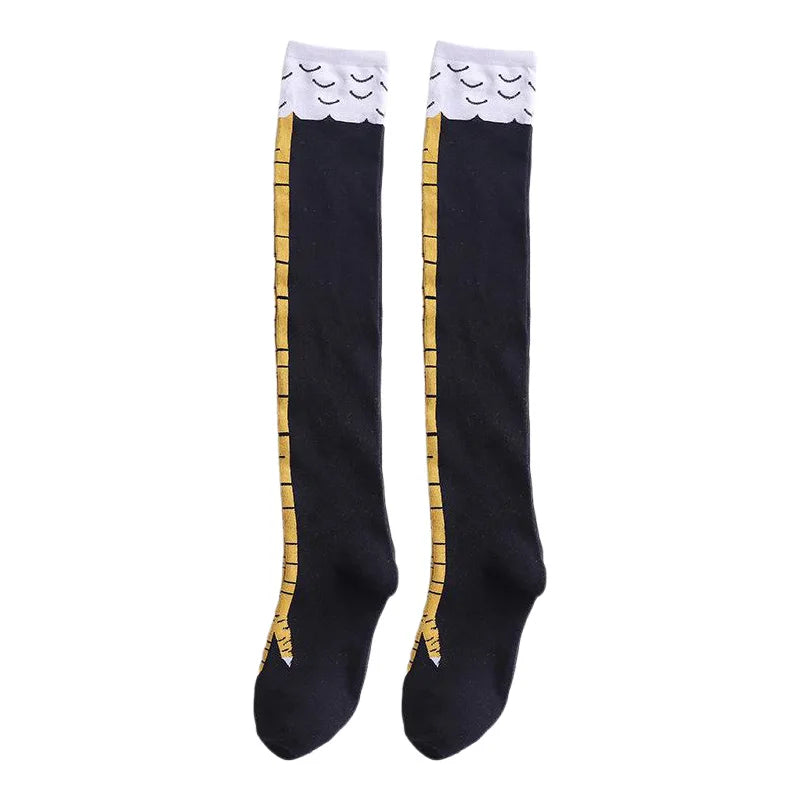 Black socks with a gold chicken print and white ruffled cuffs