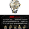 A silver and gold-toned quartz watch with a metal bracelet and a diamond-encrusted dial.