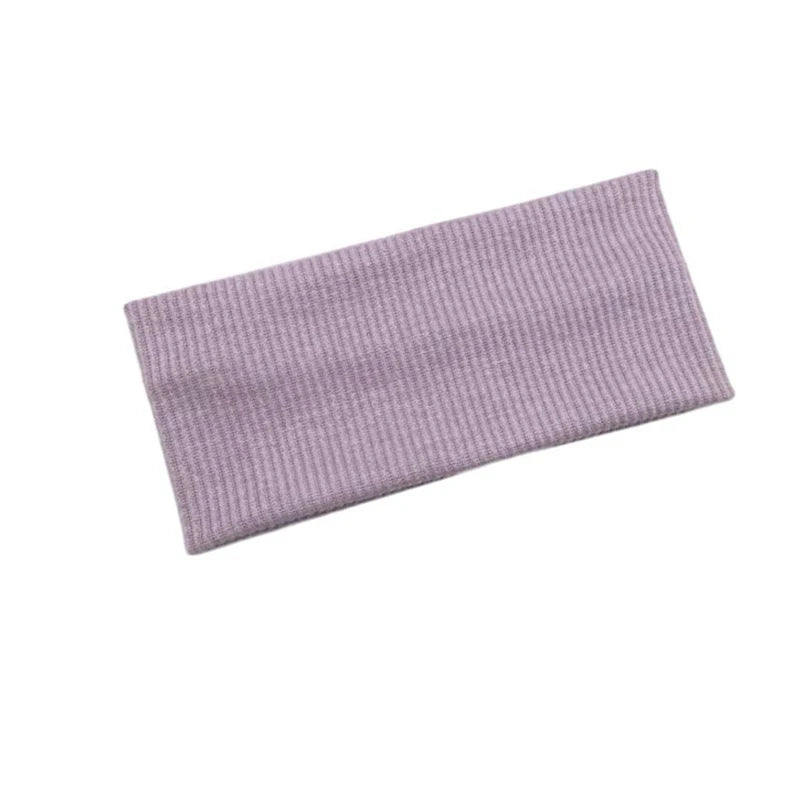 A lavender knitted sports headband designed for yoga and gym activities.