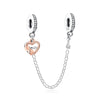 A silver necklace featuring a family tree charm pendant and matching hoop earrings.
