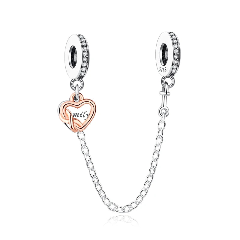 A silver necklace featuring a family tree charm pendant and matching hoop earrings.