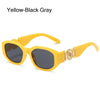 Yellow-Black Gray sunglasses with a gold metal detail and strap.