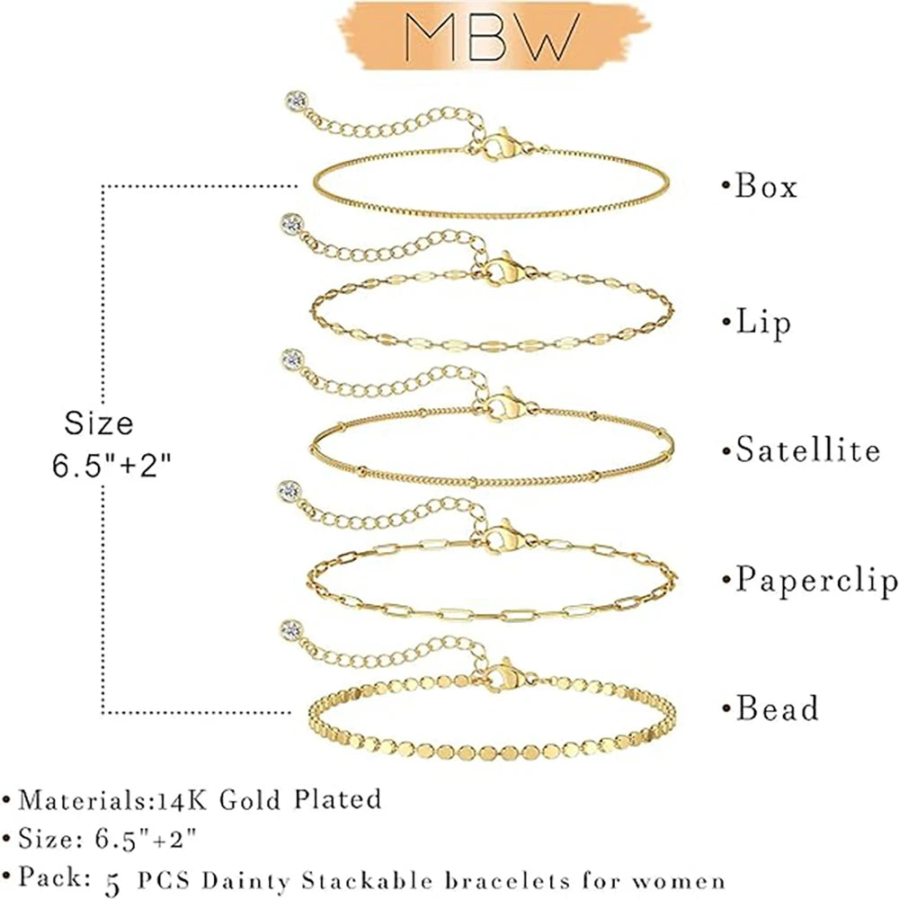 A set of five dainty gold plated stackable bracelets for women featuring box, lip, satellite, paperclip, and bead styles.