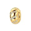 A gold-toned charm bracelet featuring devil's eye charms and small diamonds.