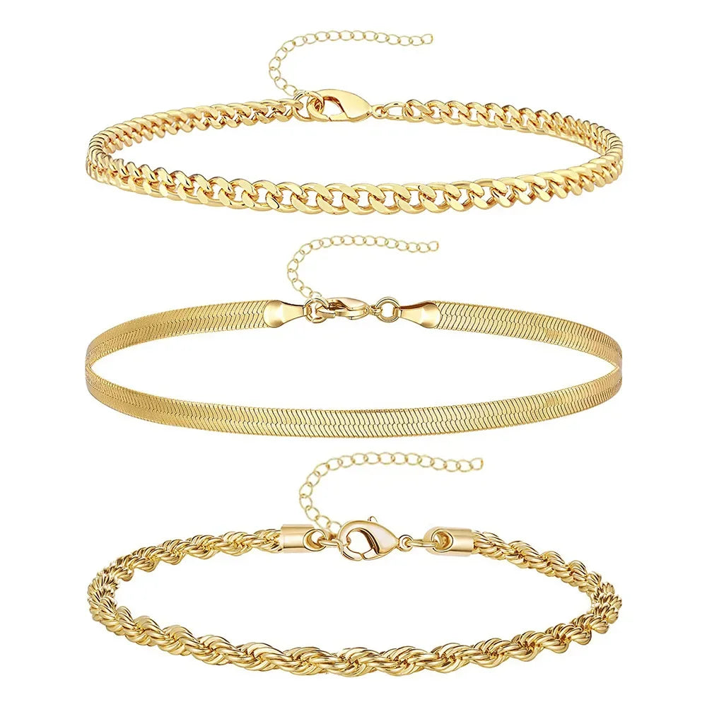 A set of three gold-toned waterproof stainless steel anklets for women displayed against a white background.