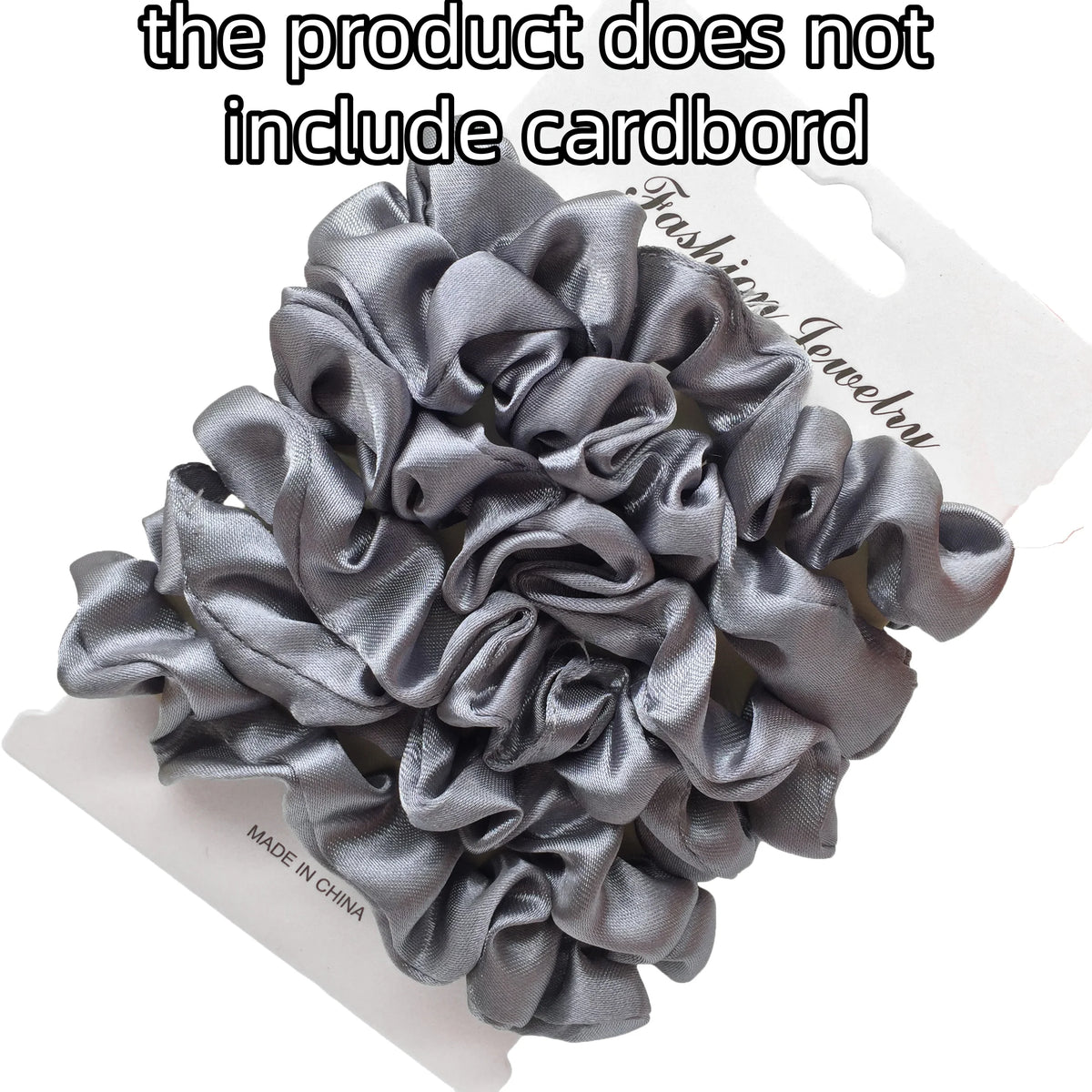 A pile of gray satin fabric scrunchies is shown on a white background.