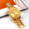 A gold-toned minimalist quartz wristwatch with a round face and gold bracelet is displayed on a white background.