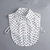 White blouse with black polka dots featuring a false collar and detachable neckline.