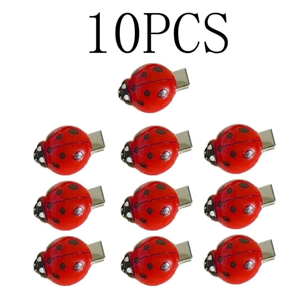 A set of ten red ladybug hair clips.