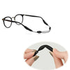 Black adjustable anti-slip eyeglass retainer strap being held by fingers