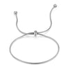 Charmet de cheville ajustable, pendentif en argent avec chaîne et bandeau circulaire délicat.