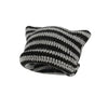 A knitted beanie hat featuring a striped pattern of black and gray yarn.