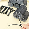 A set of 18 self-gripping hair rollers for curling, showing various sizes and a black metal tool.