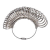 A silver precision metal ring sizer and mandrel tool kit with coiled rings.