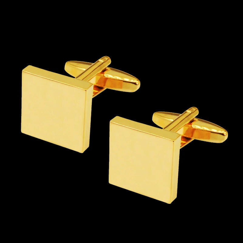 A pair of gold-toned square cufflinks with a hinged design against a black background.